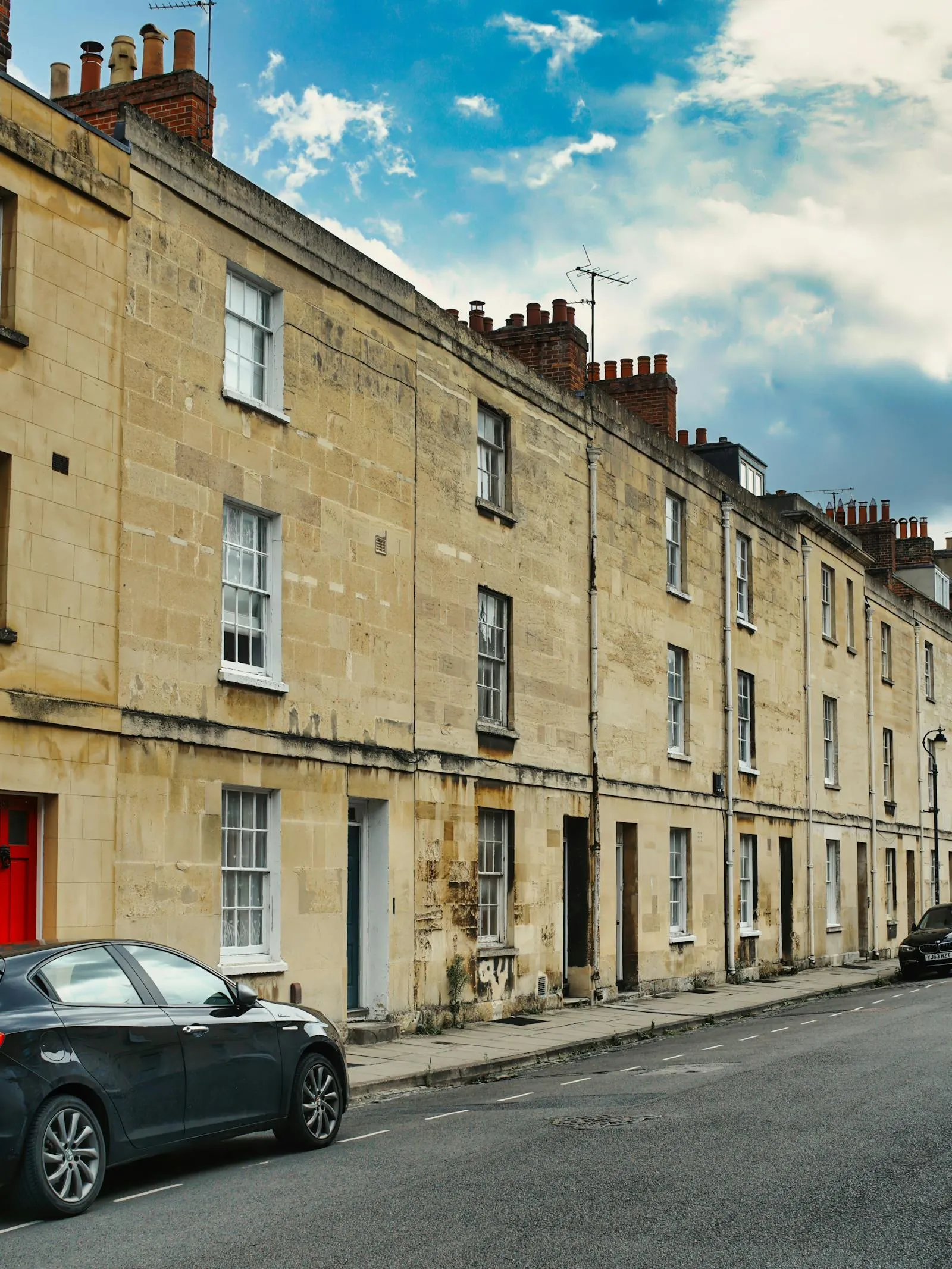 A row of cream-stone Georgian terraced houses on a UK street — period stock representative of the older built environment around the wider Bristol area, including parts of Long Ashton.